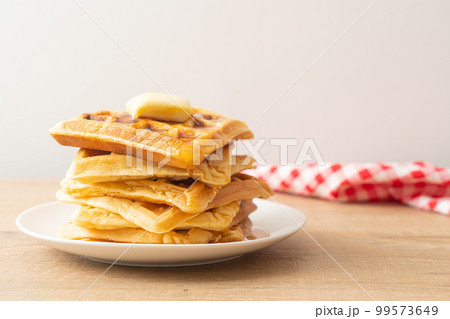 waffle stack with butter and honey 99573649
