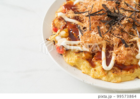 Japanese Traditional Pizza that called Okonomiyaki Japanese Traditional Pizza that called Okonomiyaki 99573864