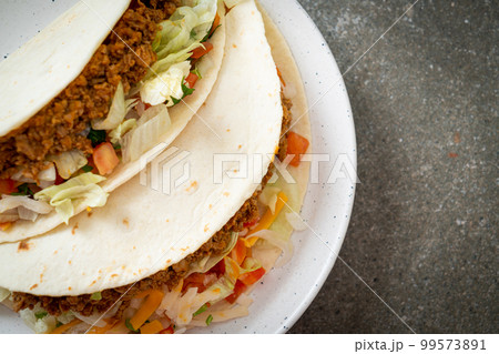 Mexican tacos with minced chicken Mexican tacos with minced chicken 99573891