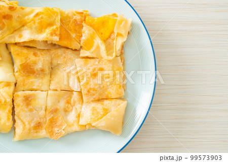 roti with egg and sweetened condensed milk roti with egg and sweetened condensed milk 99573903