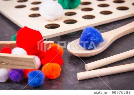 Colorful pompoms. Development of kids motor skills, coordination, creativity and logical thinking 99576288