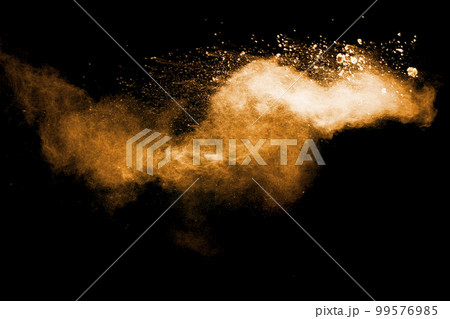 Abstract orange powder explosion on black background. Freeze motion of orange powder splash. Abstract orange powder explosion on black background. Freeze motion of orange powder splash. 99576985