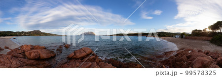 Rocky and Sandy Beach in Porto Istana, Sardinia, Italy. Tavolara Island in Background. 99578325
