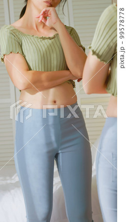woman dissatisfied about body shape 99578778
