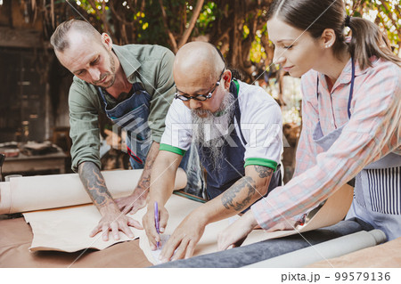 group of people leather handcraft artist and designer working together to selection best leather for new products group of people leather handcraft artist and designer working together to selection best leather for new products 99579136