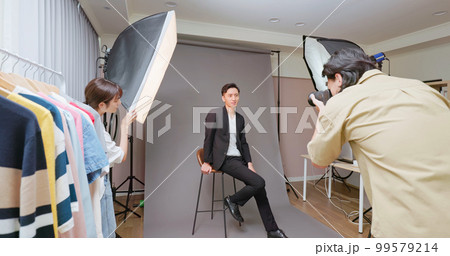 Photographer taking picture Photographer taking picture 99579214