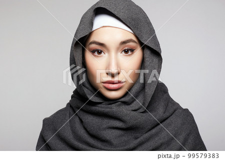 beautiful young woman in Hijab or scarf. fashion muslim girl portrait beautiful young woman in Hijab or scarf. fashion muslim girl portrait 99579383