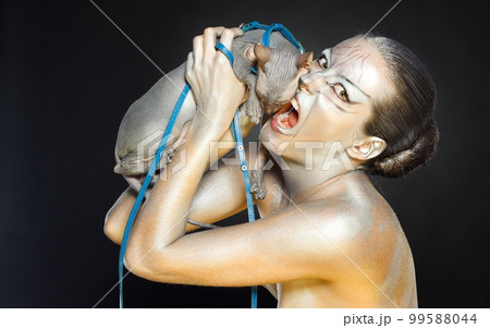 european model in cat make-up and bodyart 99588044