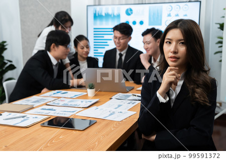 Focus portrait of asian female manger with blurred background in harmony. 99591372