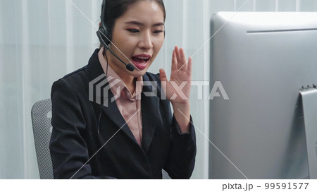 Enthusiastic female operator provide helpful customer service to customer. 99591577