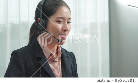 Enthusiastic female operator provide helpful customer service to customer. 99591581