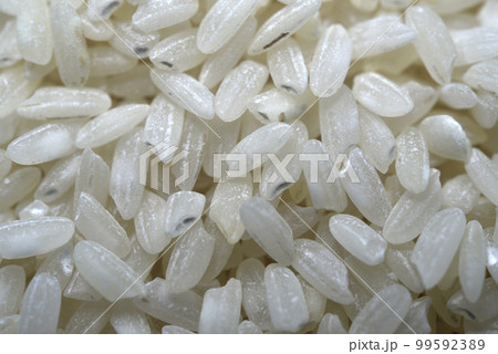 White rice close-up. Rice grains as a background. Dry rice. White rice close-up. Rice grains as a background. Dry rice. 99592389