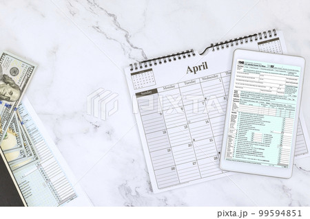 Time for tax season with 1040 form for federal individual income taxes in US 99594851