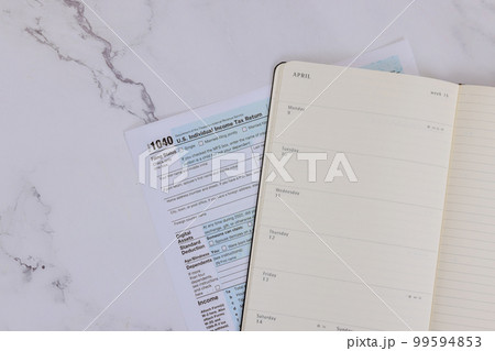 It is tax season in the US with 1040 federal individual income tax return 99594853