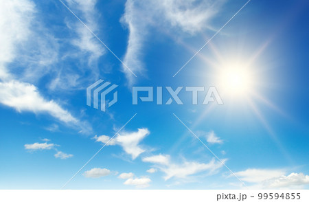 Bright sun on beautiful blue sky with white clouds. 99594855
