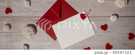 Banner Greeting or invitation card mock up with red envelope on wooden background. Romantic Small hearts Valentine day. Blank paper card copy space for your text. Holiday morning Banner Greeting or invitation card mock up with red envelope on wooden background. Romantic Small hearts Valentine day. Blank paper card copy space for your text. Holiday morning 99597101