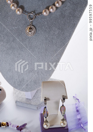 author beautiful  pearls jewelry  demonstrated on maneken. fashion and jewelry concept 99597559