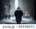 Man in the city walking at snow storm 99598051