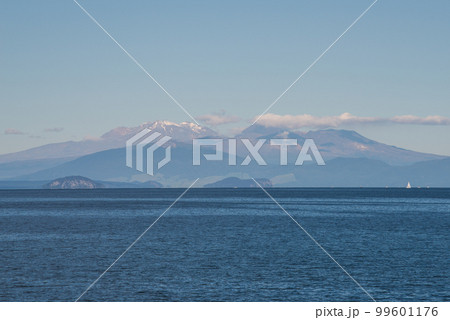 The scenery view of Tongariro national park view from lake Taupo the largest fresh water lake in New Zealand. 99601176