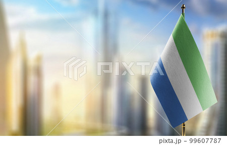 Small flags of the Sierra Leone on an abstract blurry background 99607787
