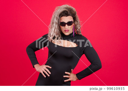 Drag queen person wearing sunglasses posing with rebel attitude 99610935