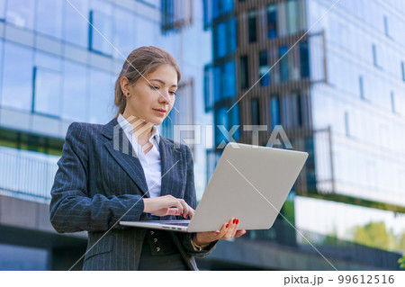 Portrait confident successful young woman, formally dressed, business woman 99612516