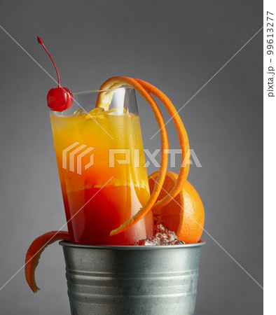 Cocktail tequila sunrise in a metal bucket with ice. Cocktail tequila sunrise in a metal bucket with ice. 99613277