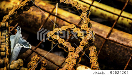 Scrap metal for recycling background. a lot of different rusty industrial part detail for melt and reused. Old rusty metal surface. Abstract background for design purpose. Warm orange color. Random Scrap metal for recycling background. a lot of different rusty industrial part detail for melt and reused. Old rusty metal surface. Abstract background for design purpose. Warm orange color. Random 99624202