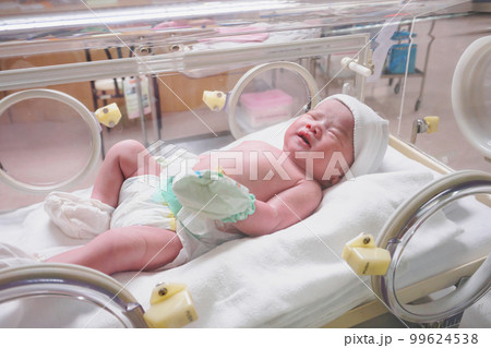 new born baby infant sleep in the incubator at hospital 99624538