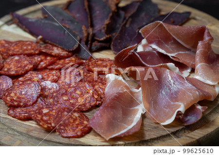 sliced ham meat sausages on the festive table 99625610