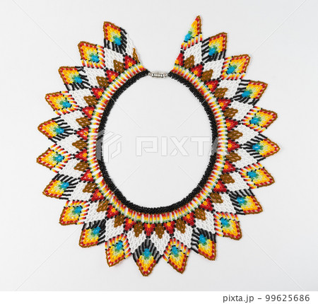 handmade colorful bead necklace close-up isolated on white background. 99625686