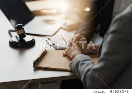 Close up of business person and lawyers discussing agreement contract in office. Law, legal services, advice, Justice concept 99628078