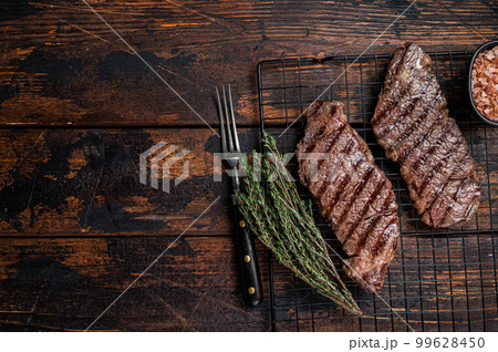 Grilled denver beef meat steak. Wooden background. Top view. Copy space 99628450