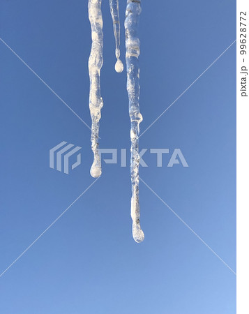 icicles on a blue background icicles on a blue background 99628772