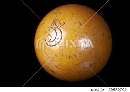 Old vintage billiard ball, number six. On black background 99629701