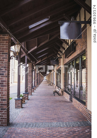 Row of shops in artificial trade city Manufactura in Ukraine 99630574