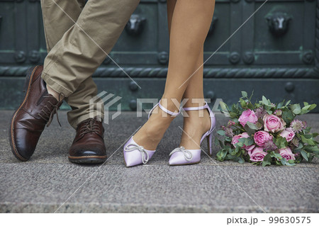 Newlyweds legs that standing the same. Wedding Newlyweds legs that standing the same. Wedding 99630575