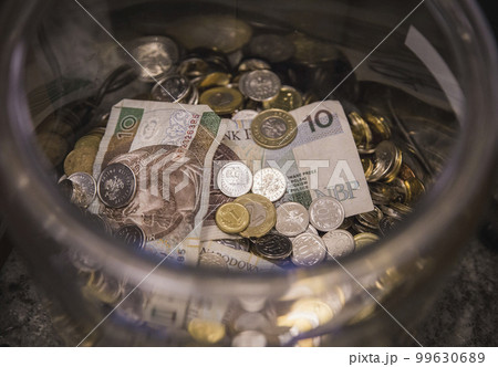 Donations in a glass jar in a cafe in Poland 99630689