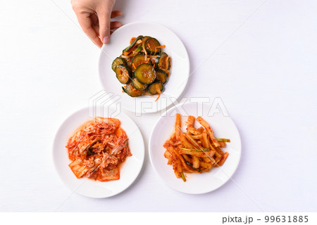 Kimchi cabbage, radish and cucumber  on white background, Korean food homemade side dish, Top view 99631885