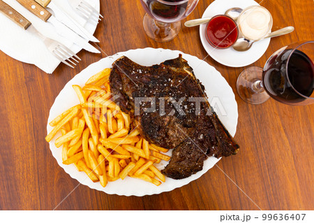 Grilled beef meat with fried potato for dinner 99636407