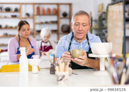 potter with his jug potter with his jug 99636526