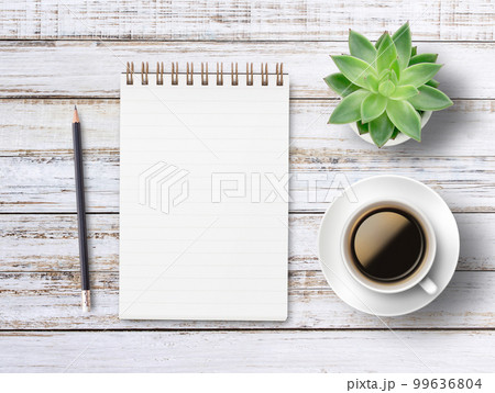 Office desk with notebook or notepad,flower,pencil and glasses, top view with copy space. 99636804