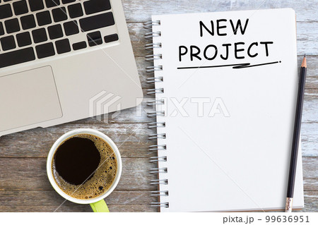 Target list in a notebook with and coffee on wood table Target list in a notebook with and coffee on wood table 99636951