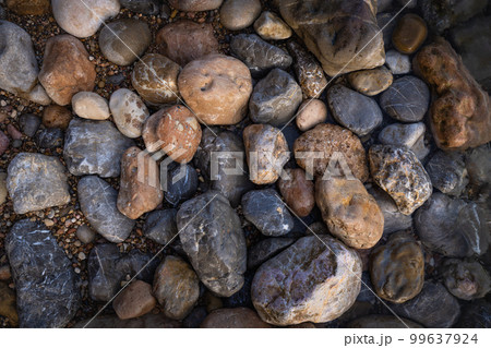 Rocky shapes on the beach. textures and patterns generated on the stones of the Ibiza. 99637924
