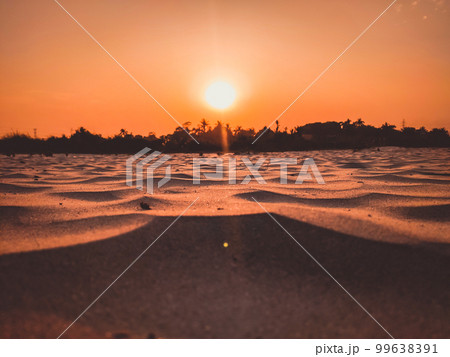 sunset in The desert, sunset desert close up short with the ground, Sand dunes sun on top of the forest, Evening sunset Sand dunes sunset in The desert, sunset desert close up short with the ground, Sand dunes sun on top of the forest, Evening sunset Sand dunes 99638391
