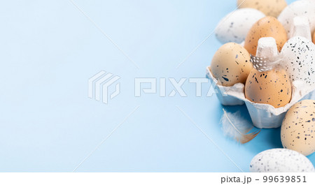 Eggs pack on a blue background Eggs pack on a blue background 99639851