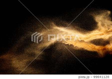 Sand explosion isolated on black background. Freeze motion of sandy dust splash.Sand texture concept. Sand explosion isolated on black background. Freeze motion of sandy dust splash.Sand texture concept. 99641120