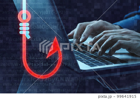 フィッシング詐欺のイメージ。釣り針のアイコンとノートパソコンを使う手のアップ。 フィッシング詐欺のイメージ。釣り針のアイコンとノートパソコンを使う手のアップ。 99641915