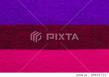 multi colored background. knitted wool fabric texture with stripes multi colored background. knitted wool fabric texture with stripes 99645723