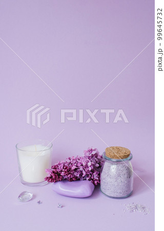 Cosmetics, soap and bath salts and lilac flowers on the background, an even layer. Copy space Cosmetics, soap and bath salts and lilac flowers on the background, an even layer. Copy space 99645732